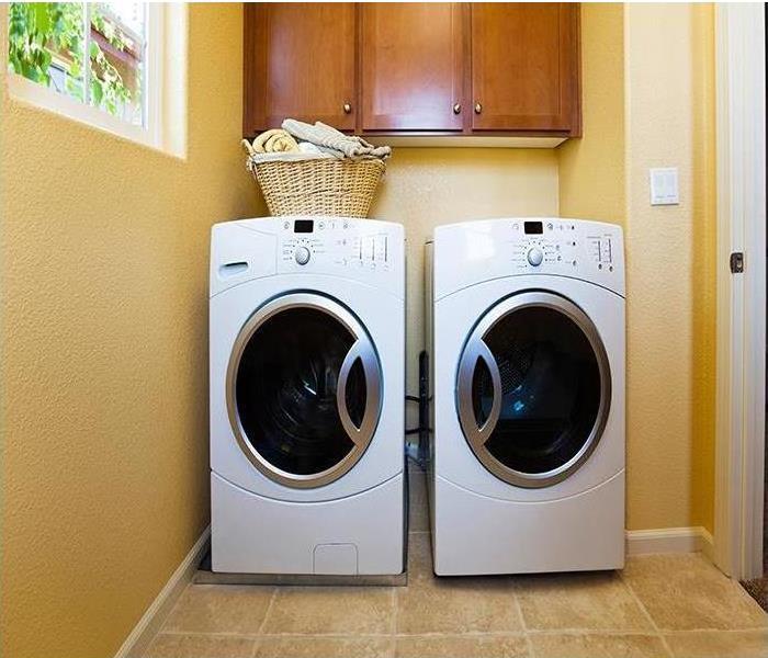 Front loaded washer and dryer in laundry room