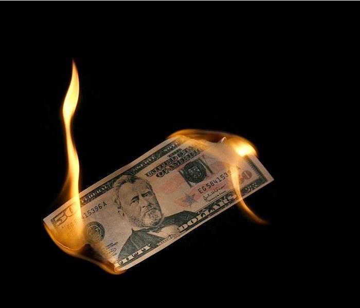 Fifty dollar bill burning at both ends