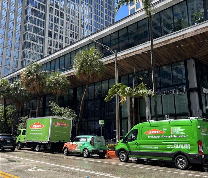SERVPRO Trucks and Vans Parked in Front of a Luxury High-Rise on Las Olas Boulevard